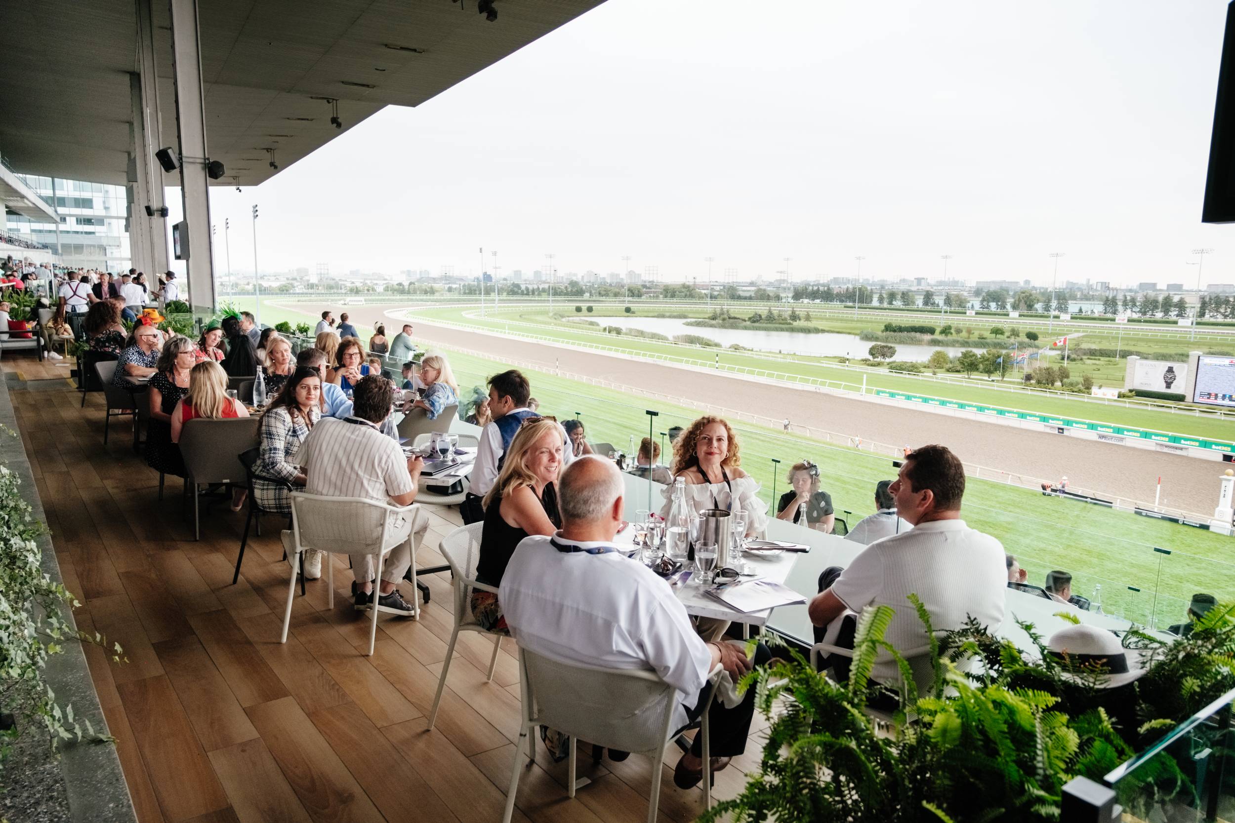 people watching racing on the stella artois terrace